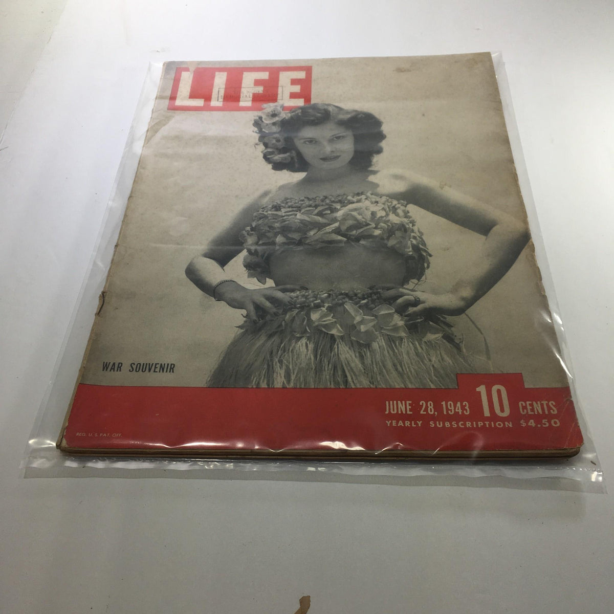 Cover of Life Magazine from June 28, 1943, featuring a woman in traditional attire with the title 'WAR SOUVENIR', showcasing vintage design and historical significance as a collectible item from World War II.