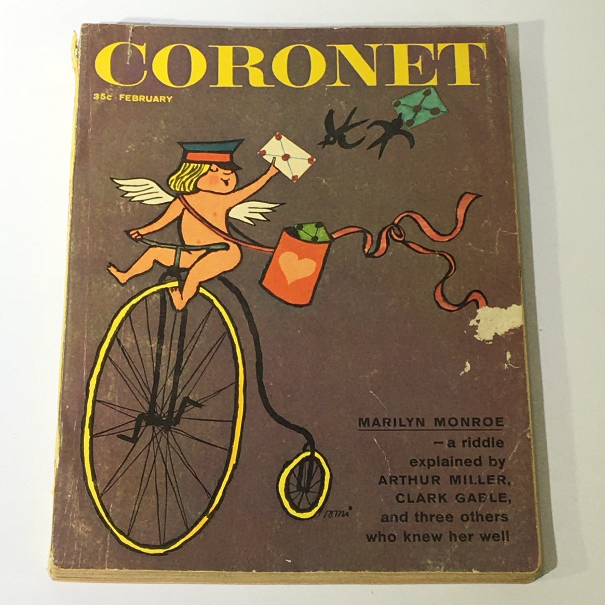 VTG Coronet Magazine February 1961 featuring Marilyn Monroe on the cover, with artwork of a cherub on a bicycle holding letters, emphasizing vintage magazine appeal and Hollywood history.