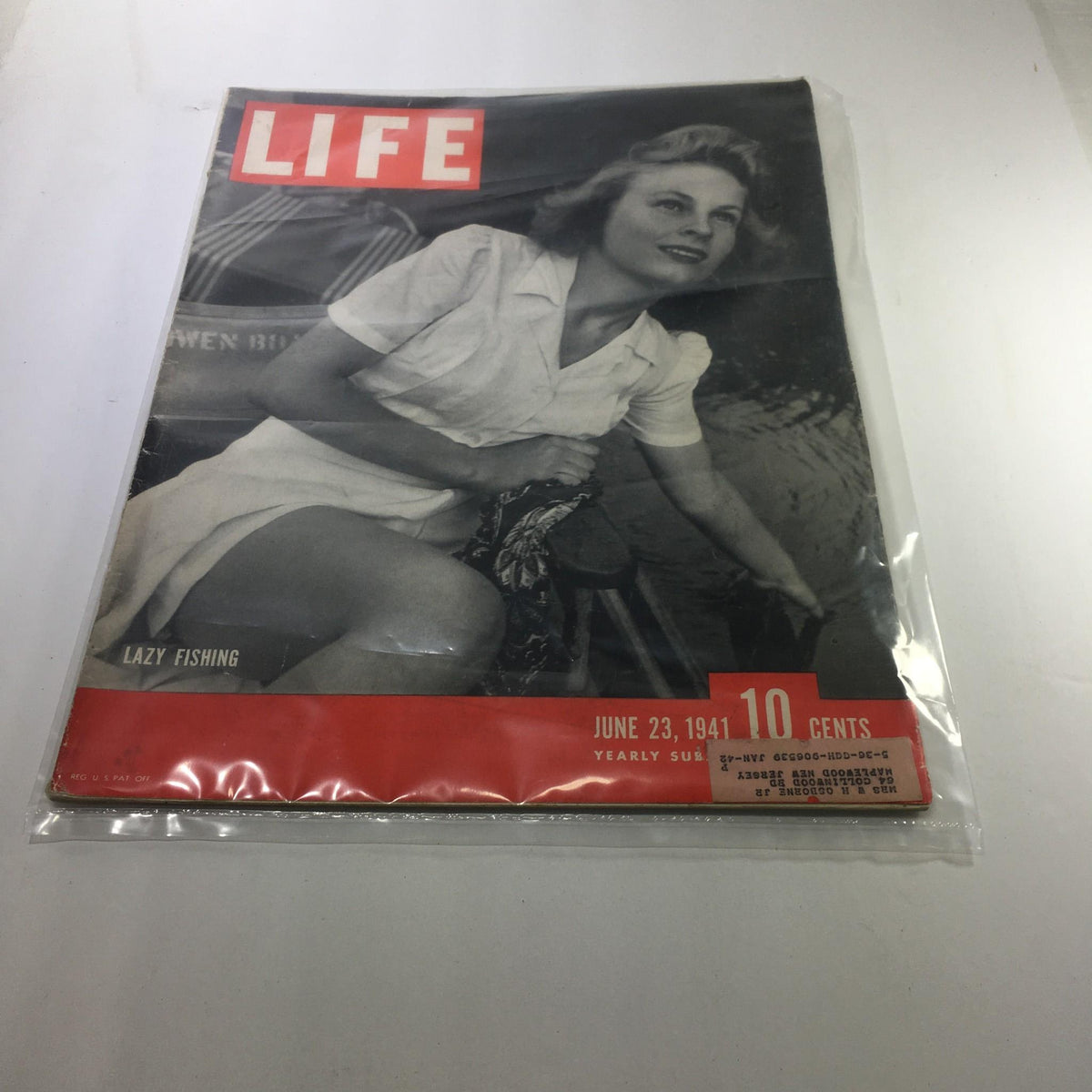 Life Magazine cover from June 23, 1941 titled 'Lazy Fishing', featuring a woman seated outdoors, captivatingly posing against a backdrop of fishing and leisure.