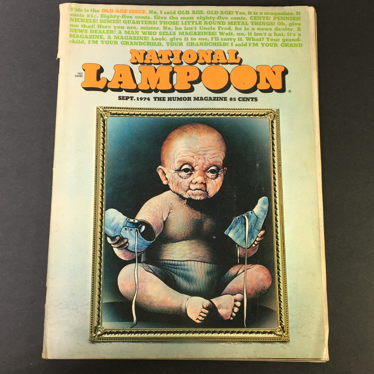 Cover of National Lampoon Magazine September 1974 Old Age Issue featuring an artistic depiction of a baby with aged features, holding blue shoes, and showcasing the iconic title and humor of the publication.