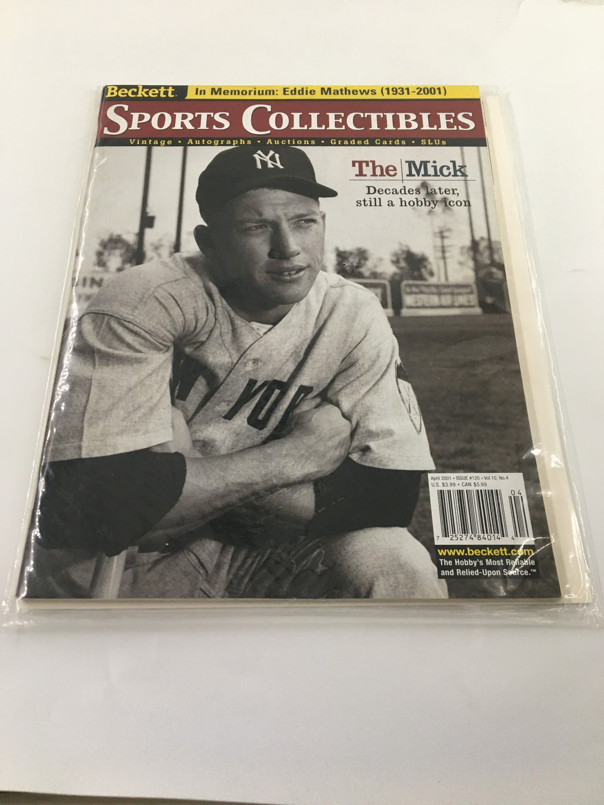 Cover image of Beckett Sports Collectibles April 2001 #120 featuring Mickey Mantle, a legendary baseball player, with a vintage design and protected in plastic.