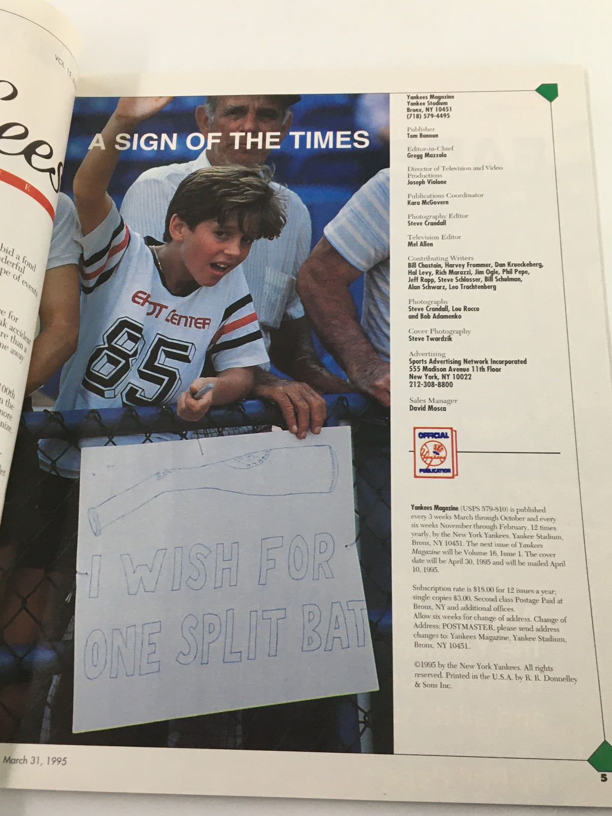 Inside page of Yankees Magazine March 31, 1995 showing a enthusiastic young fan holding a sign that reads 'I wish for one split bat'.