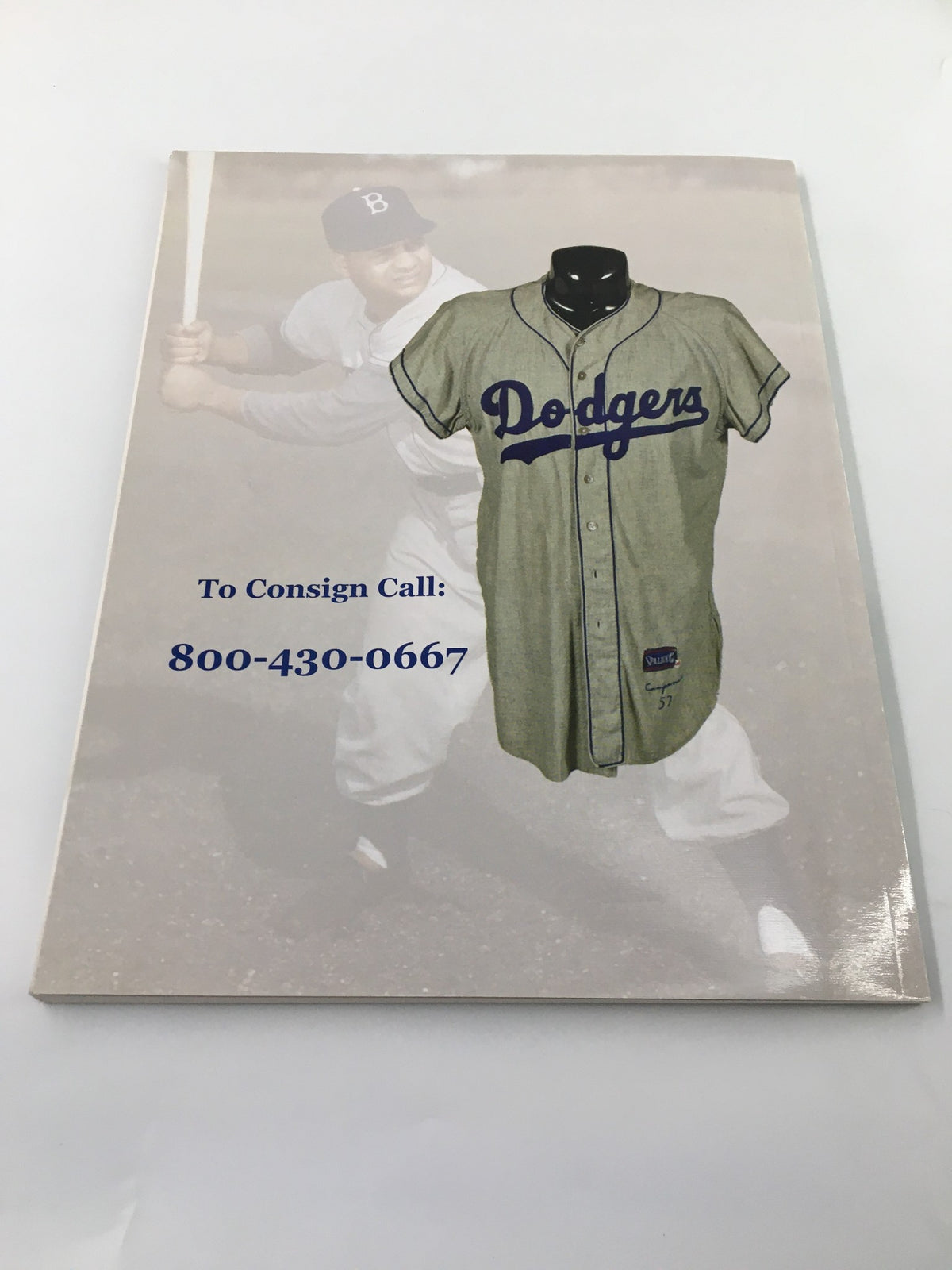 Cover of American Memorabilia Magazine March 2007 featuring a vintage Dodger baseball jersey, highlighting Babe Ruth Spring Auction. Contact number included for consigning memorabilia.