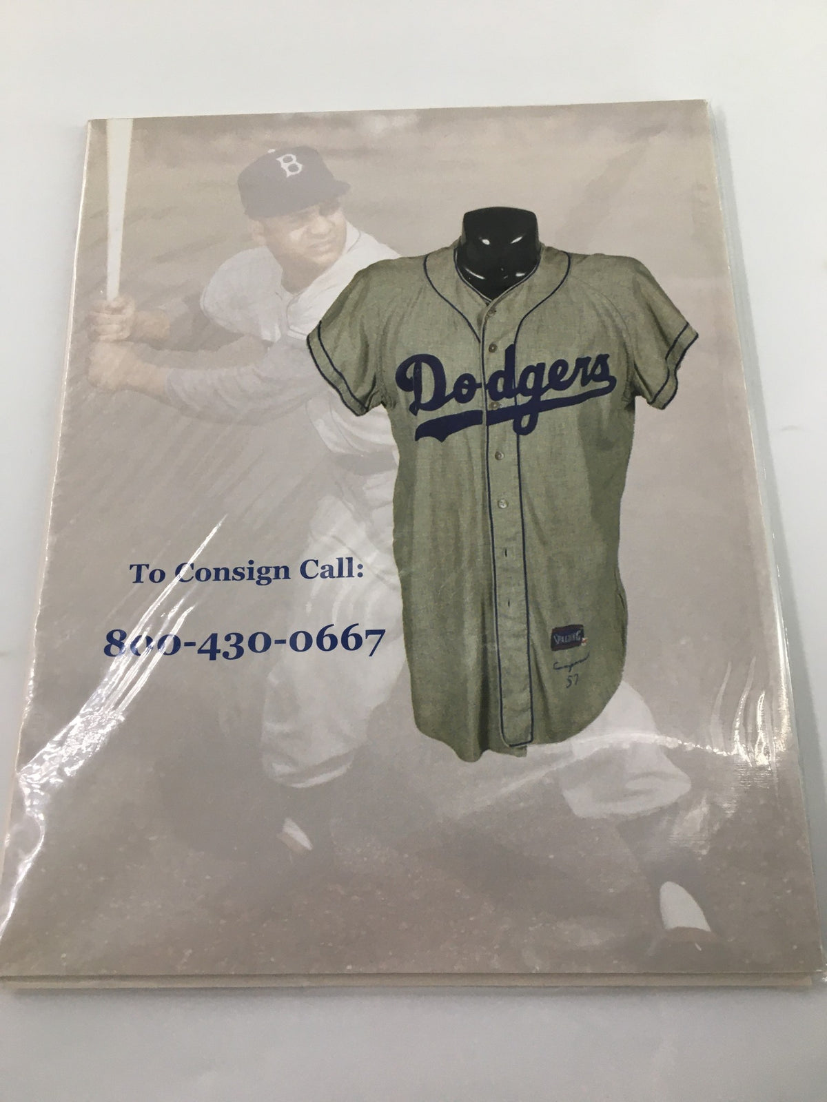 Close-up of American Memorabilia Magazine March 2007 showcasing a vintage Dodger baseball jersey on the cover, promoting Babe Ruth Spring Auction with consigning details.