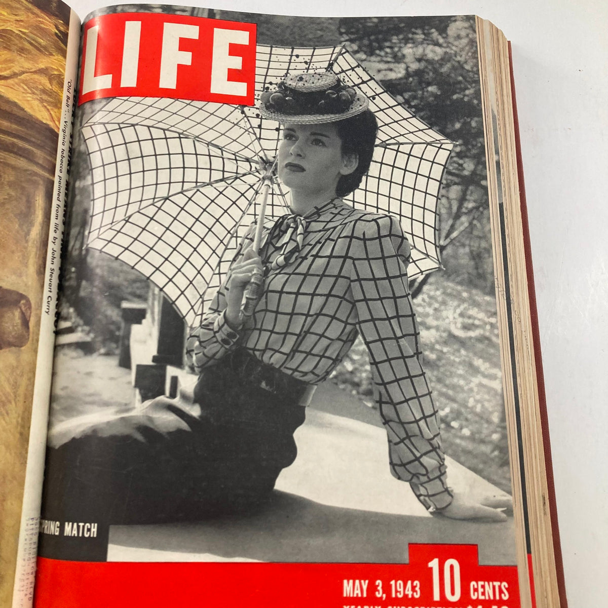 Cover of the VTG 1943 Bound Life Magazine showing a stylish woman under an umbrella from May 3, 1943, highlighting mid-century fashion.