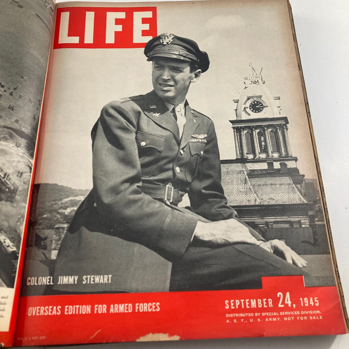 Cover of the VTG 1945 Bound Life Magazine with partial image revealing 'Auto Worker', showing a torn page in a vintage magazine collection.