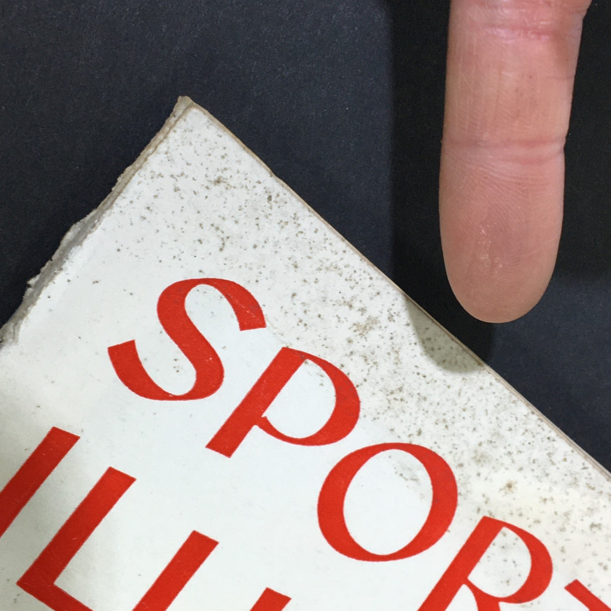 Detailed view of the top corner of Sports Illustrated Magazine August 20 1956 showing minor wear and age marks, highlighting its collectible nature.