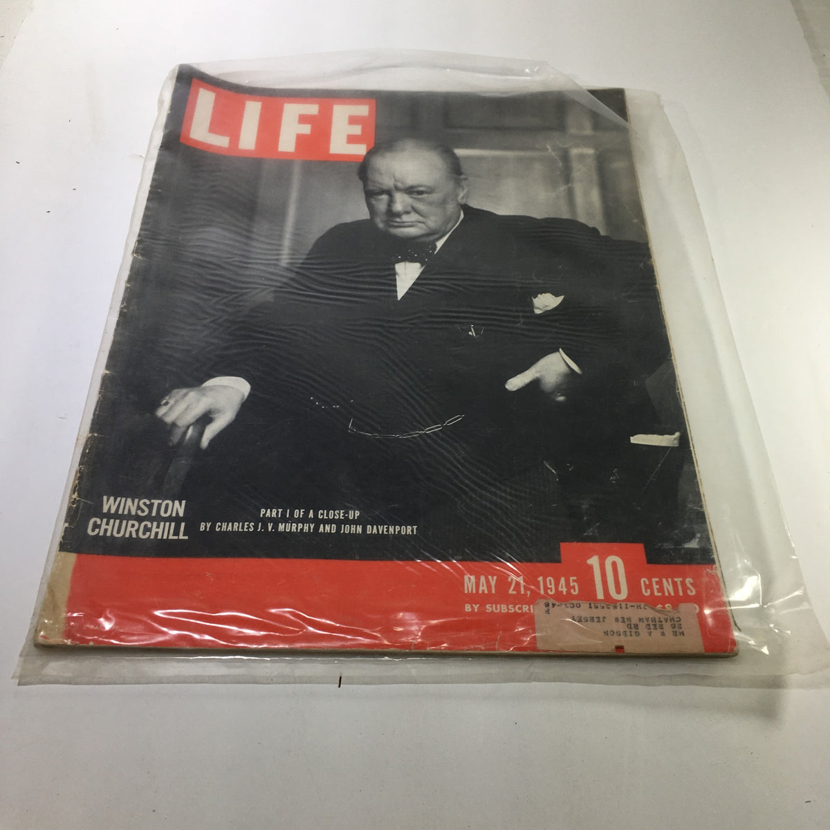 Cover of Life Magazine dated May 21, 1945, featuring Winston Churchill in a sophisticated black and white portrait. This vintage issue presents part I of a close-up on Churchill, celebrating his leadership during World War II. The magazine's iconic red header highlights its historical significance, making it a collector's item from the mid-20th century.