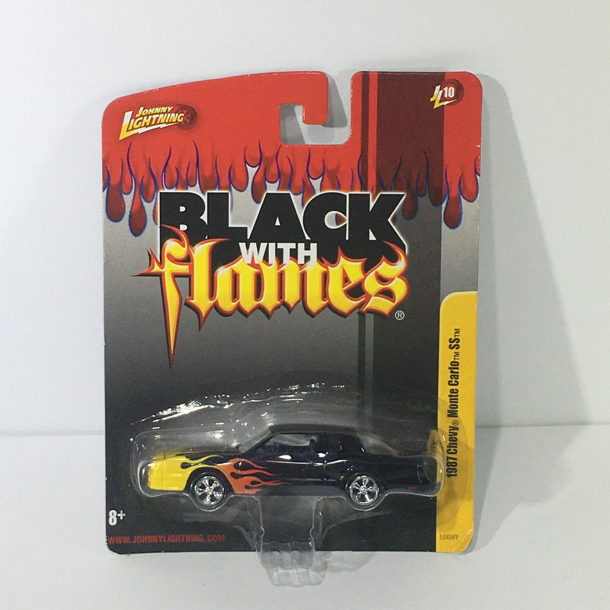 Johnny Lightning Black with Flames 1987 Chevy Monte Carlo SS die-cast model displayed in packaging, featuring vibrant flame graphics.