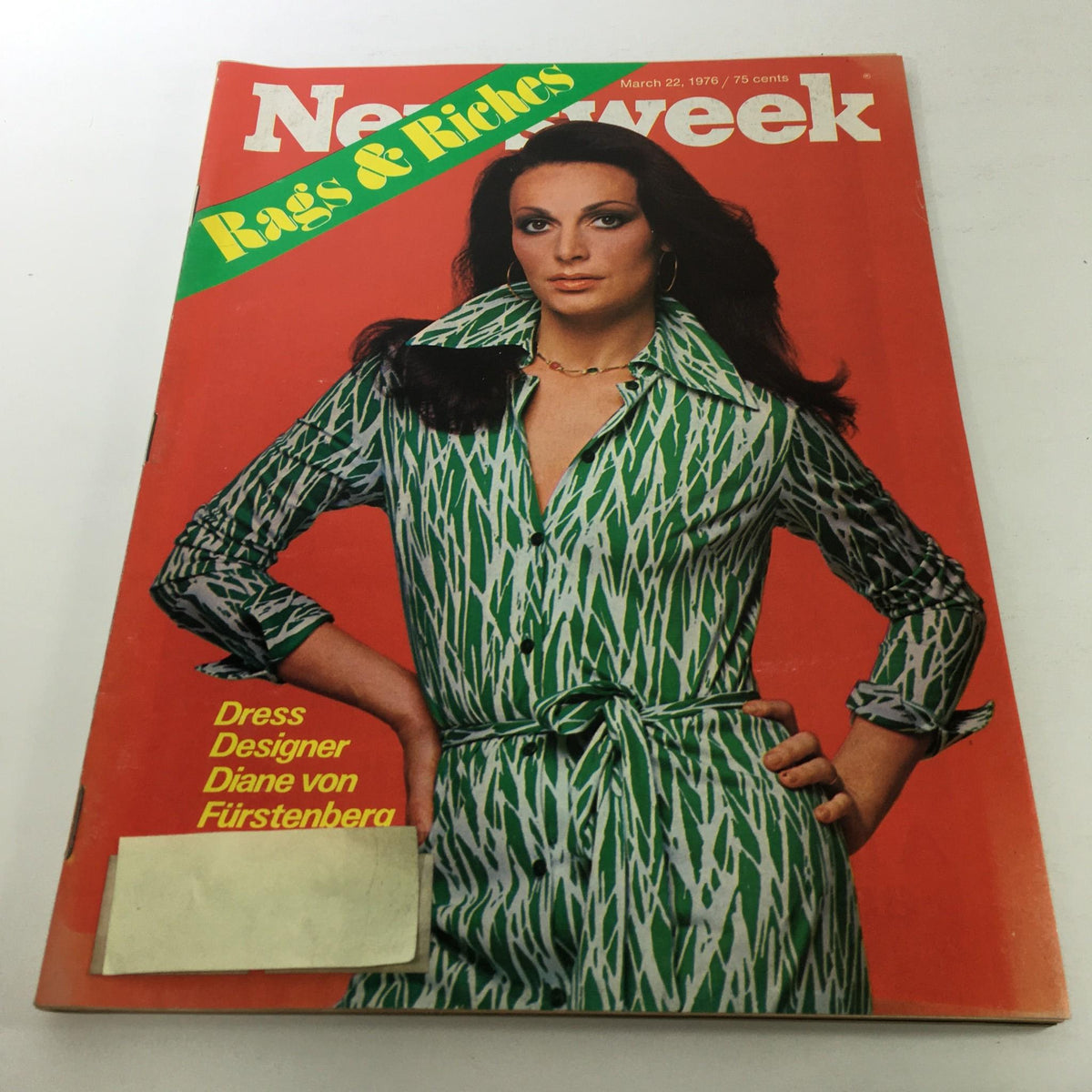 Cover of Newsweek Magazine from March 22, 1976 featuring a striking image of Diane von Furstenberg in a bold green patterned dress, with the title 'Rags & Riches' prominently displayed. This vintage magazine captures the essence of 1970s fashion and culture.
