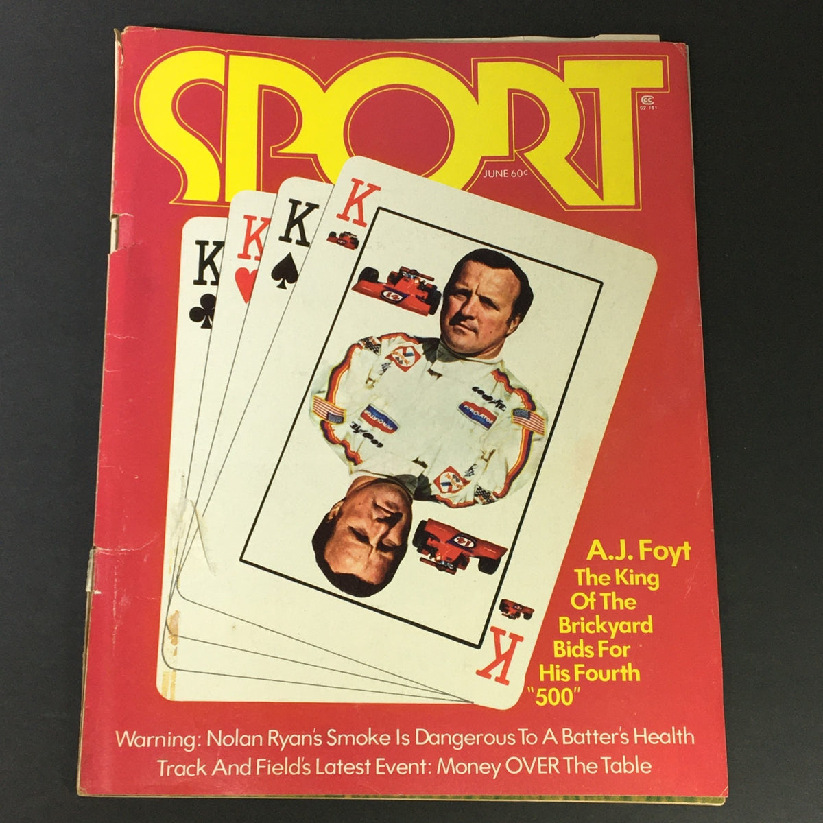 Cover of VTG Sport Magazine June 1973 featuring A.J. Foyt and playing cards, showcasing the theme of competitive sports.