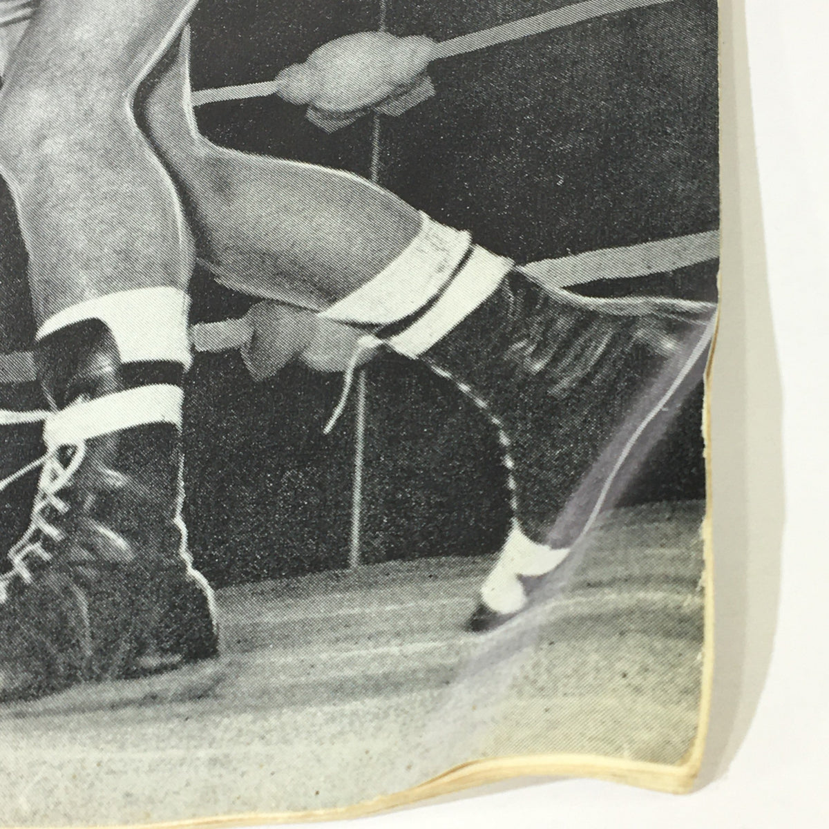 Close-up of athlete's legs wearing boxing shoes, featured in the VTG Amateur Athlete Magazine May 1967 Vol 38 #5, showcasing the dynamic style of athletic footwear and sports history.
