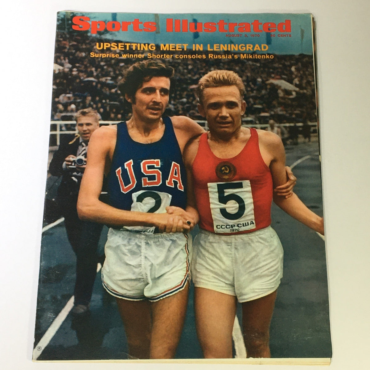 VTG Sports Illustrated Magazine August 3 1970 featuring Runner Irina Mikitenko on the cover, showcasing two competitors shaking hands after a race, reflecting a moment of sportsmanship.