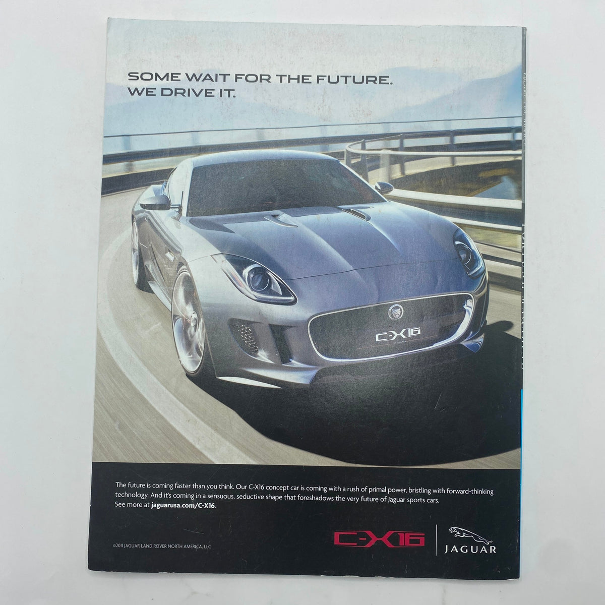 Back cover of Fortune Magazine January 16, 2012, featuring an advertisement for the Jaguar CX-16, highlighting futuristic automotive design and technology.