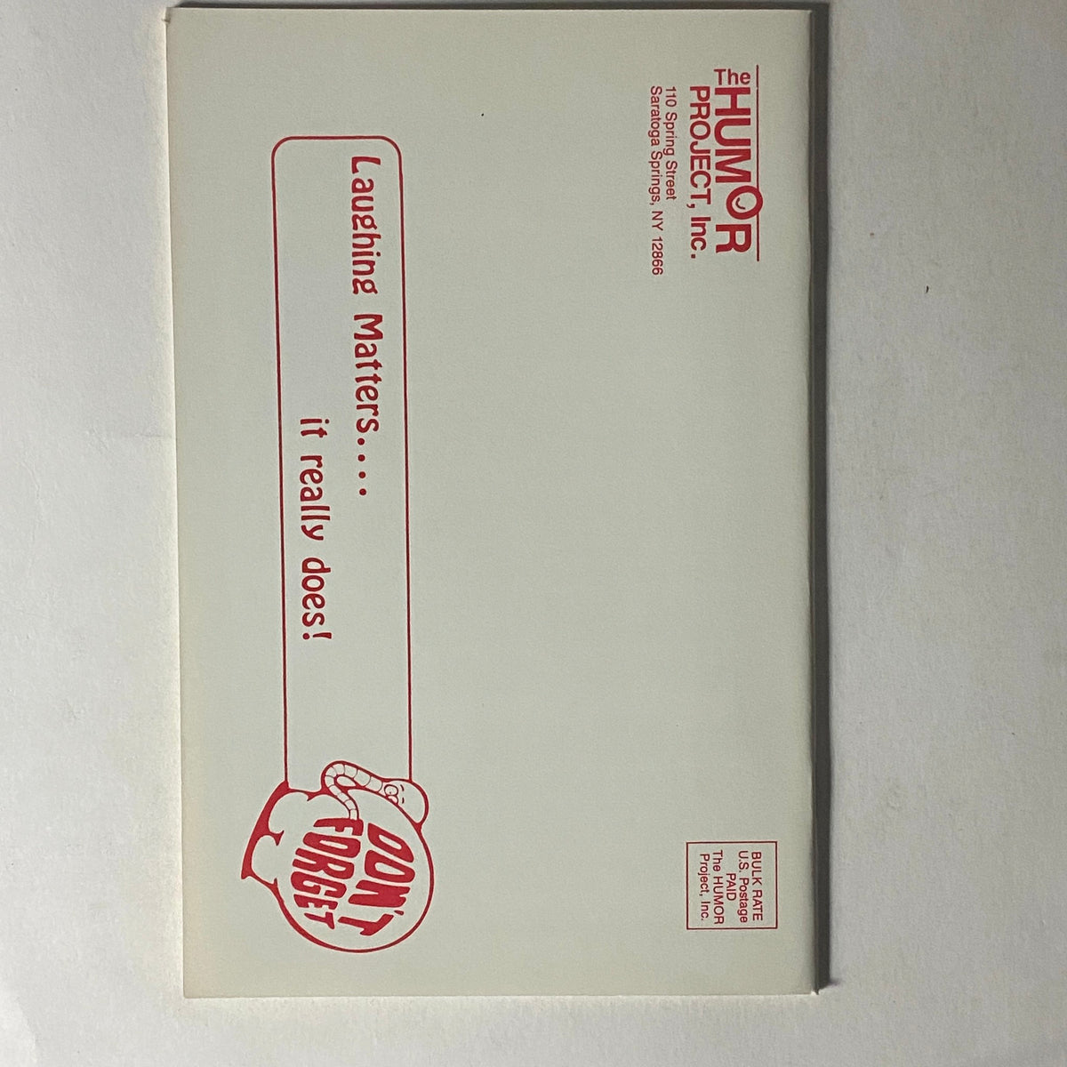 Envelope for The Humor Project, featuring the phrase 'Laughing Matters... it really does!' with a playful design, related to Laughing Matters Volume 8 Number 1.
