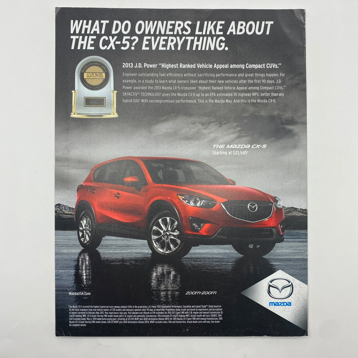 Advertisement for the Mazda CX-5 in Fortune Magazine July 21, 2014, highlighting its accolades and features, emphasizing its J.D. Power award for Compact SUVs.