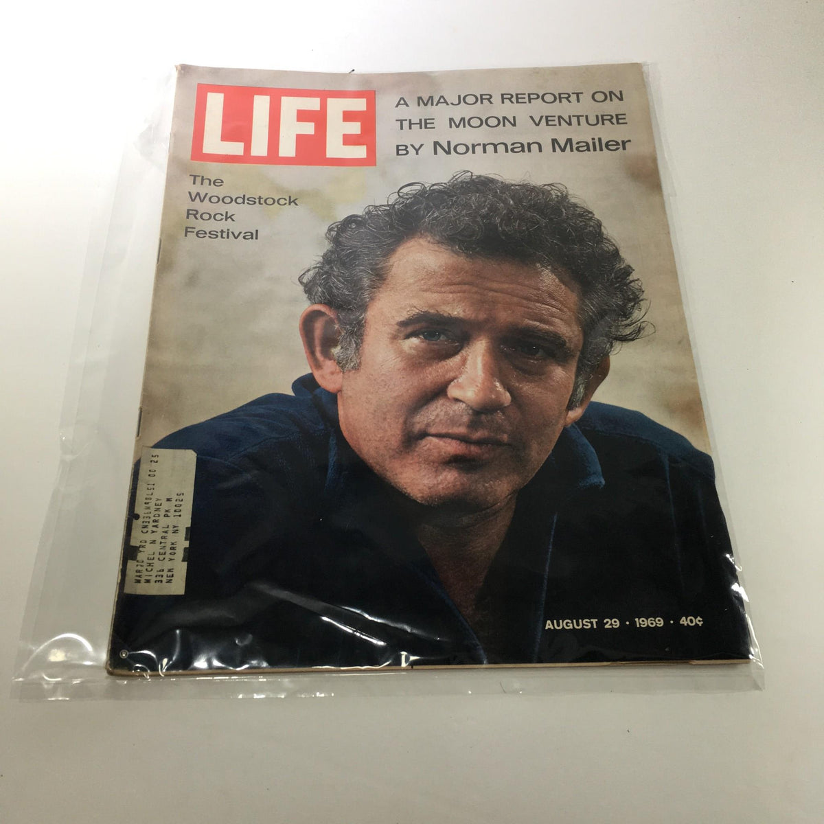 Vintage Life Magazine from August 29, 1969 featuring a major report on the moon venture by Norman Mailer, showcasing the cover with iconic red block letters and portrait of an individual, reflecting the cultural significance of the Apollo 11 mission.