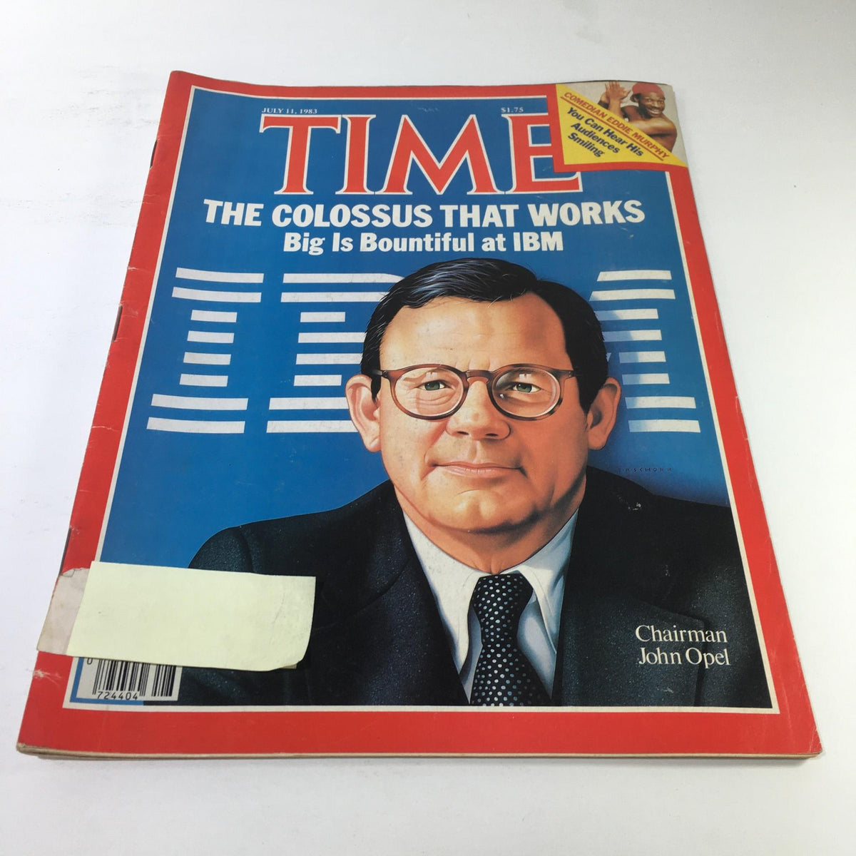 Time Magazine cover from July 11, 1983 titled 'The Colossus That Works', featuring a portrait of Chairman John Opel of IBM, showcasing the technological advancements and corporate dynamics of the 1980s.