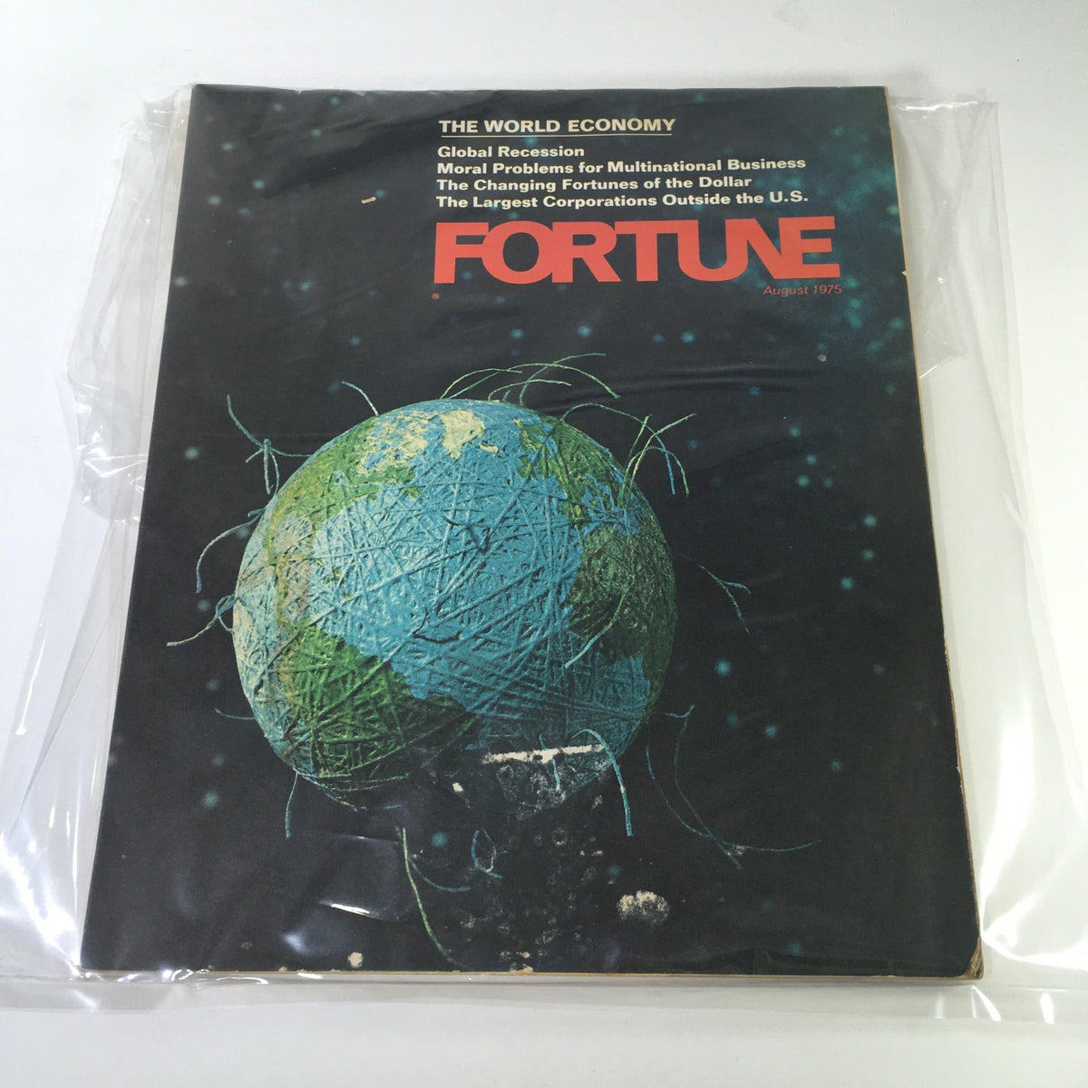 Fortune Magazine from August 1975 featuring the cover story on 'The World Economy: Global Recession', displaying a graphical representation of the Earth and discussing issues such as moral problems for multinational businesses and the largest corporations outside the U.S.