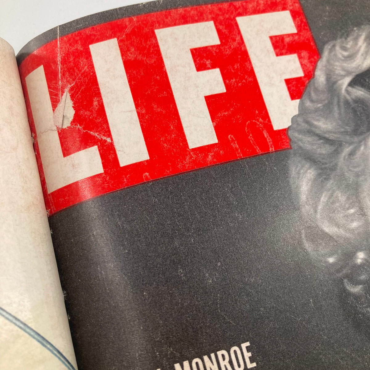 Close-up of the title section from the cover of the Vintage 1952 Bound Life Magazine featuring Marilyn Monroe, highlighting the iconic LIFE logo.