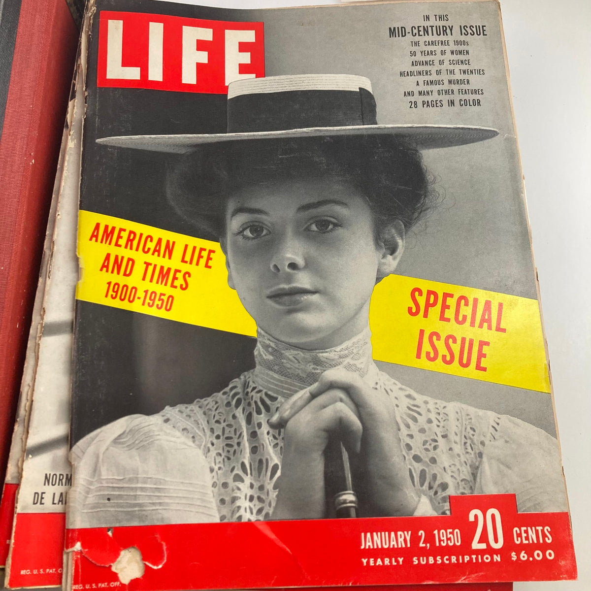 Cover of January 2, 1950, issue of LIFE magazine featuring a young woman in a historical gown, celebrating American life and times from 1900 to 1950.