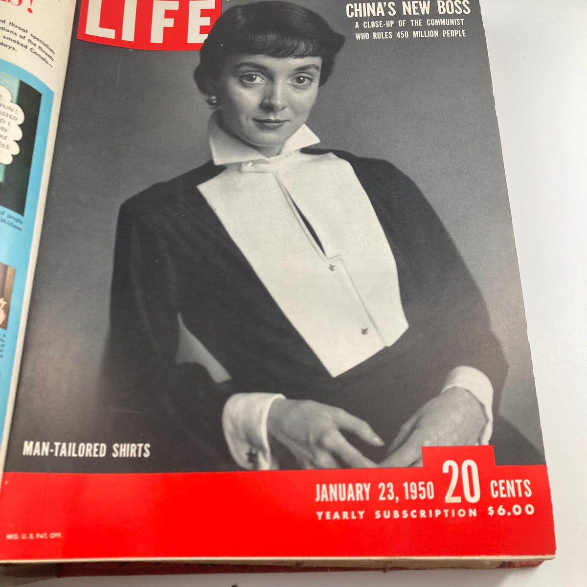 Vintage 1950 LIFE Magazine cover featuring a woman in a stylish black and white outfit, highlighting fashion trends from January 23, 1950.