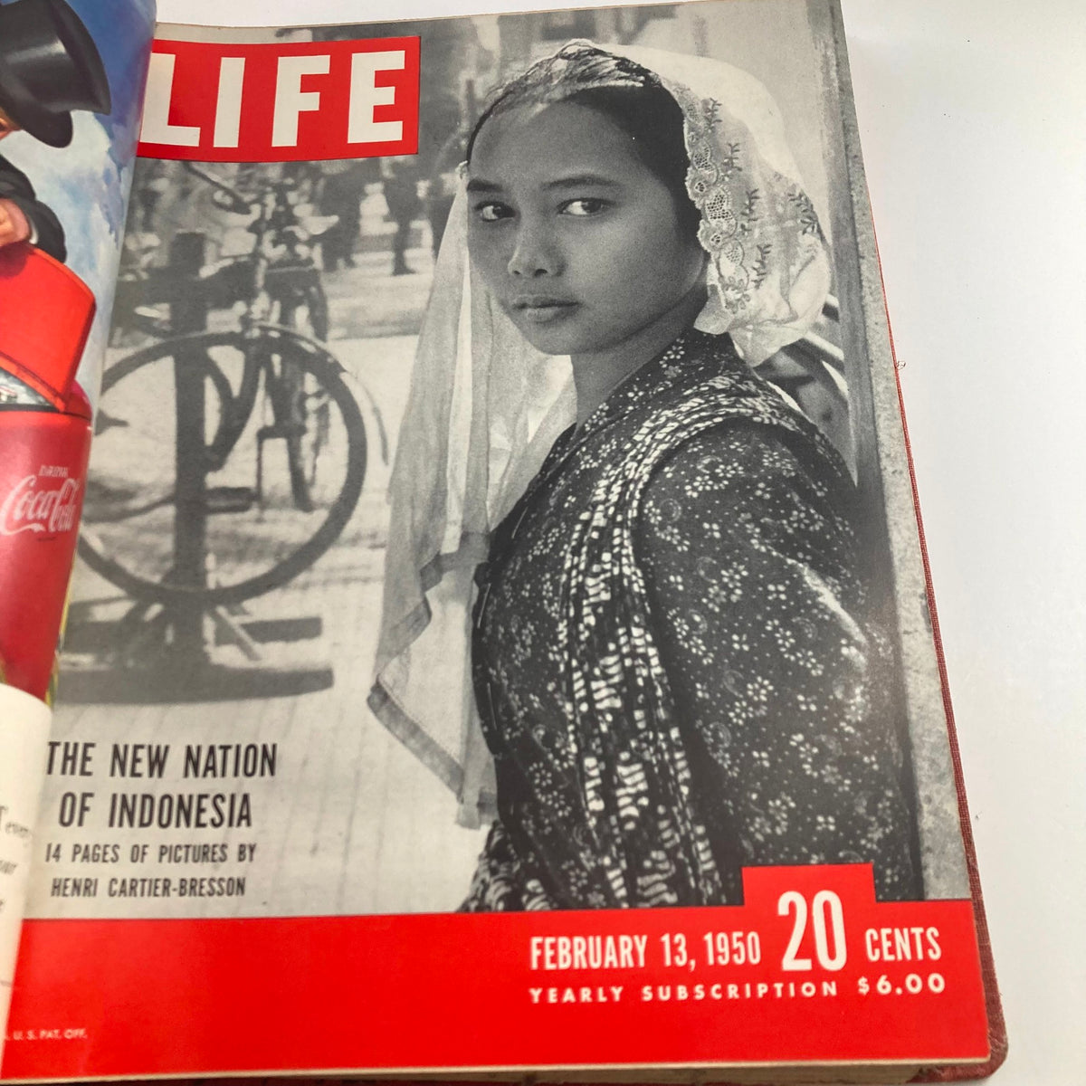 Vintage 1950 LIFE Magazine cover featuring a young Indonesian girl in traditional attire, dated February 13, 1950, capturing cultural diversity.
