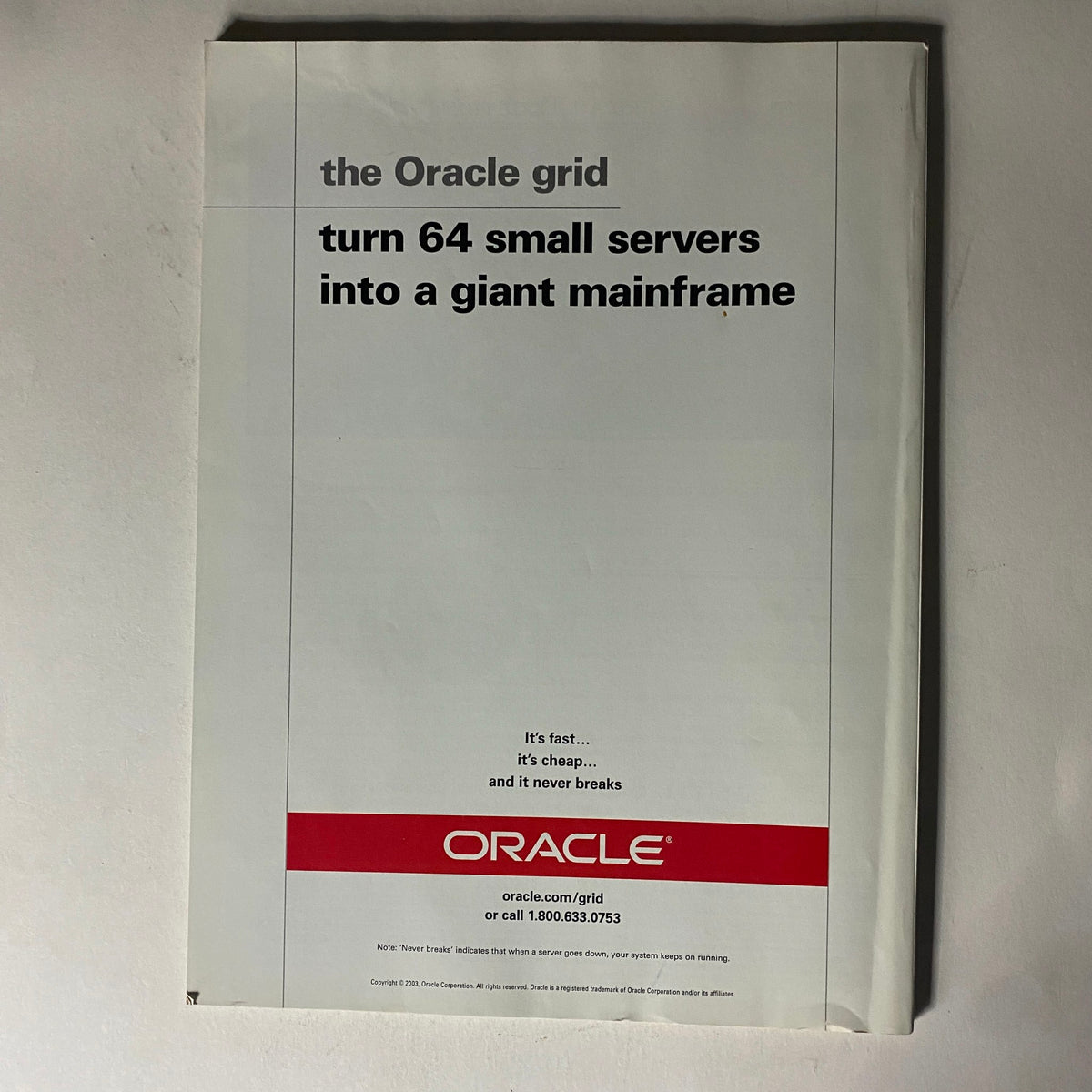 Fortune Magazine February 9, 2004 back cover featuring an advertisement for Oracle's services, promoting the Oracle grid technology that turns 64 small servers into a giant mainframe.