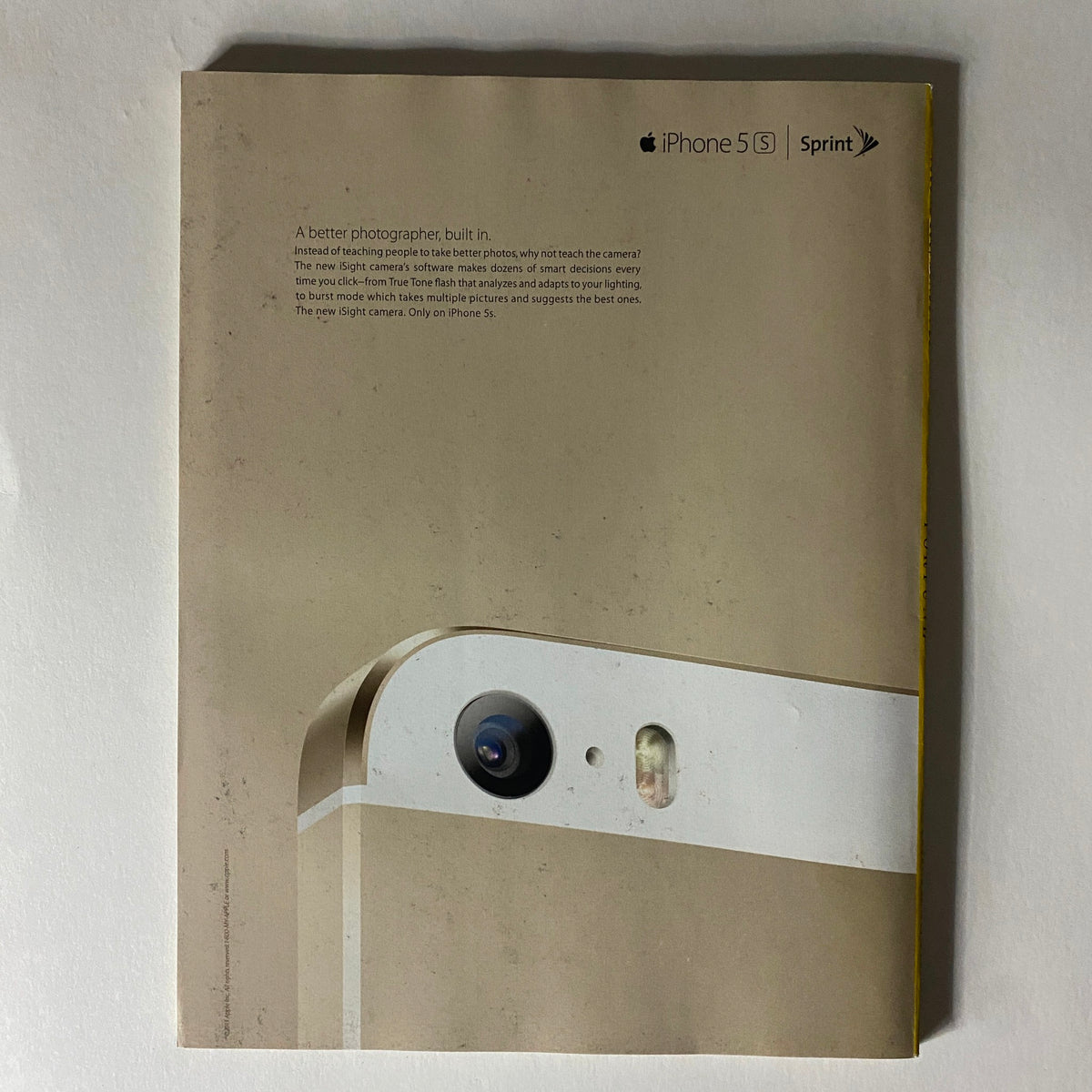 Back cover of Fortune Magazine December 23, 2013 Investor's Guide 2014 Special Issue highlighting the Apple iPhone 5S with a focus on its features and photography capabilities.