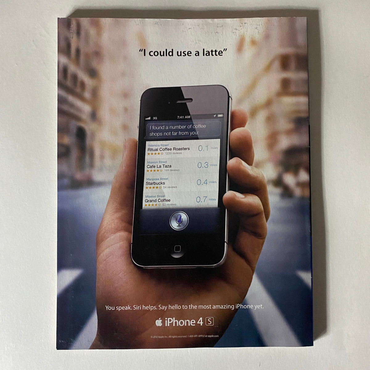 Fortune Magazine March 19, 2012 featuring a visual of an iPhone 4S advertisement showcasing Siri with the quote 'I could use a latte.' This image represents the innovative technology of Apple, illustrating how Siri enhances user experience.