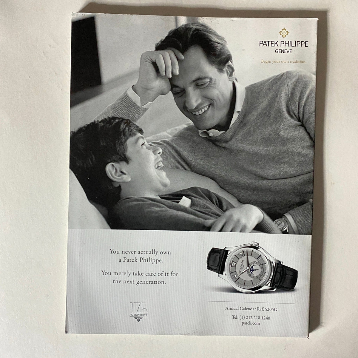 Advertisement from Fortune Magazine October 27, 2014, promoting a Patek Philippe watch with an image of a man and a young boy.