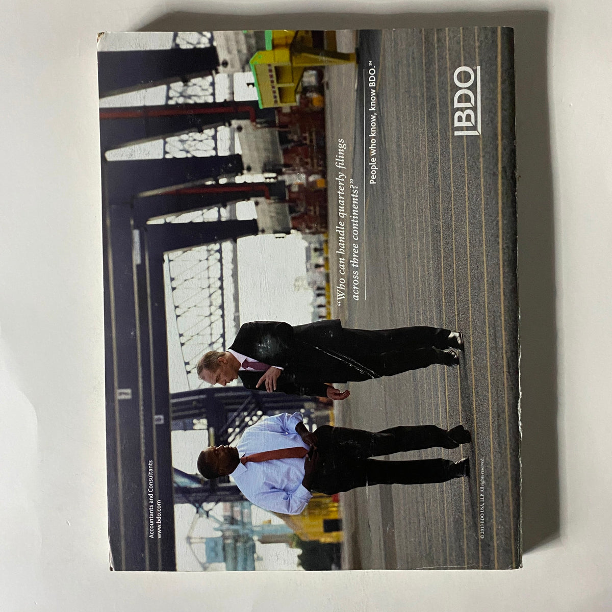 Back cover of Fortune Magazine May 20, 2013 displaying two business professionals walking in a port setting, emphasizing the magazine's business themes.
