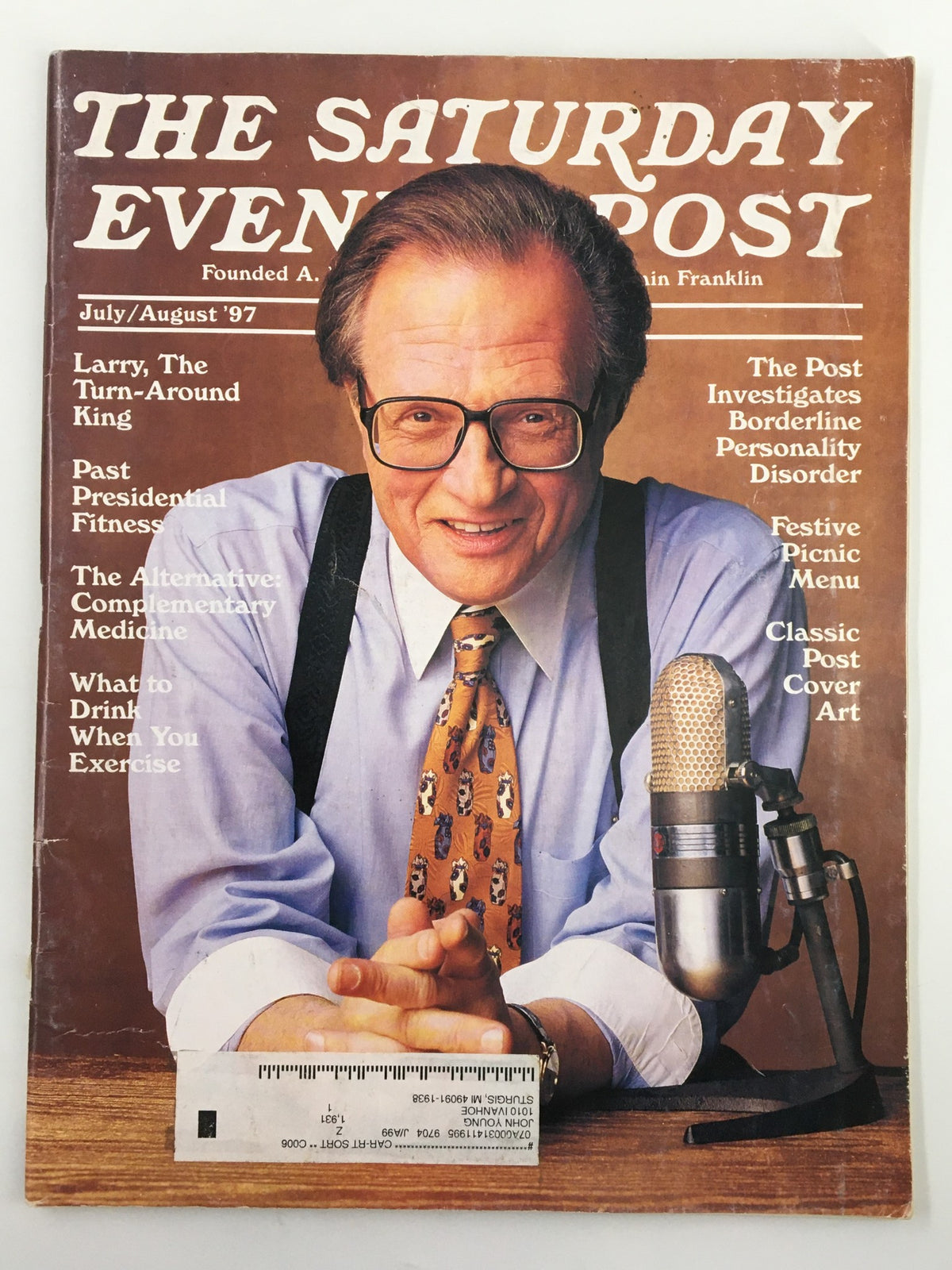 Cover of The Saturday Evening Post July/August 1997 featuring 'Larry King: The Turn-Around King'. Larry King is depicted smiling, wearing glasses and a patterned tie, with a vintage microphone in front of him, reflecting the media culture of the late 1990s.