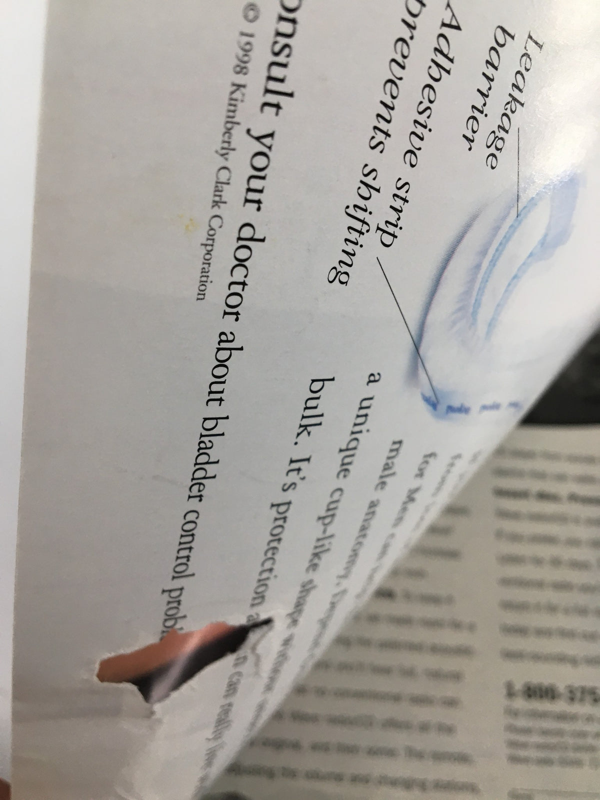 Close-up of a partially torn page from The Saturday Evening Post September 1999, featuring healthcare information and advice. This magazine issue highlights notable figures Tiger Woods and Mike Milken.