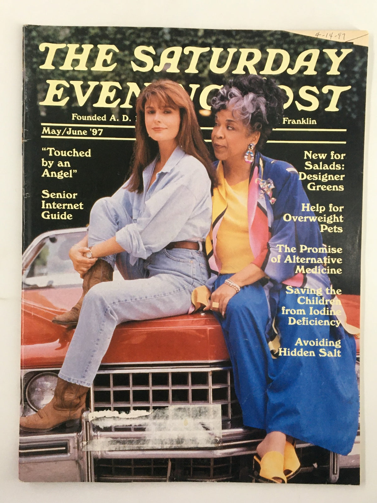 Cover of The Saturday Evening Post May 1997 featuring the title 'The Promise of Alternative Medicine', showcasing two women posing on a vintage car, with articles highlighted including 'New for Salads: Designer Greens'.