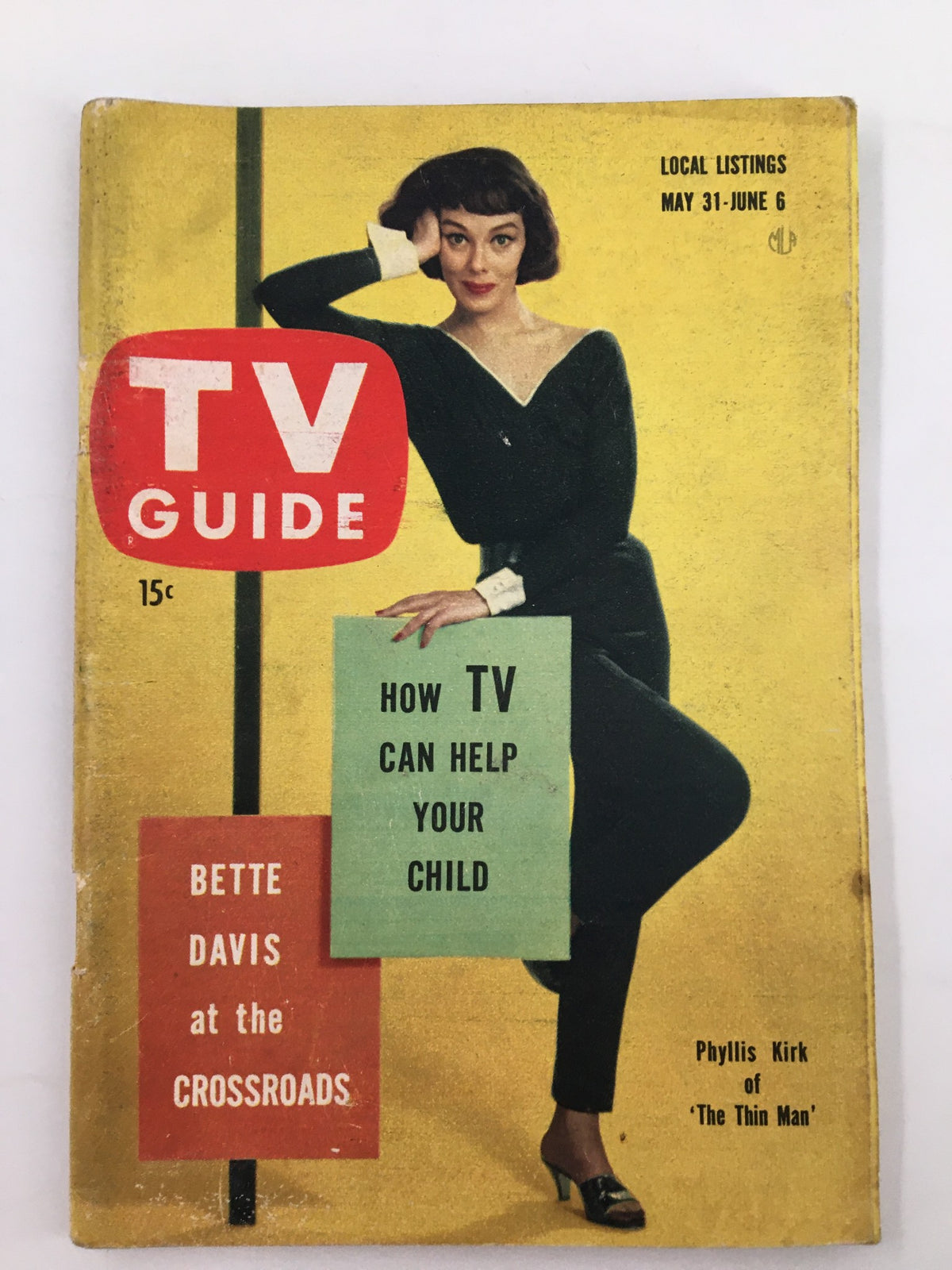 Cover of TV Guide Magazine dated May 31, 1958, featuring Phyllis Kirk in an elegant pose against a yellow background, headline reads: 'How TV Can Help Your Child.' New York Metro Edition.