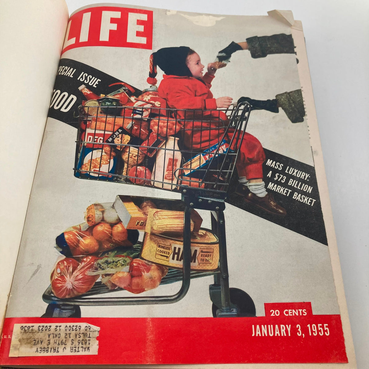 Cover of VTG 1955 Bound Life Magazine January 3 featuring a child in a shopping cart filled with groceries, highlighting themes of food in post-war America.