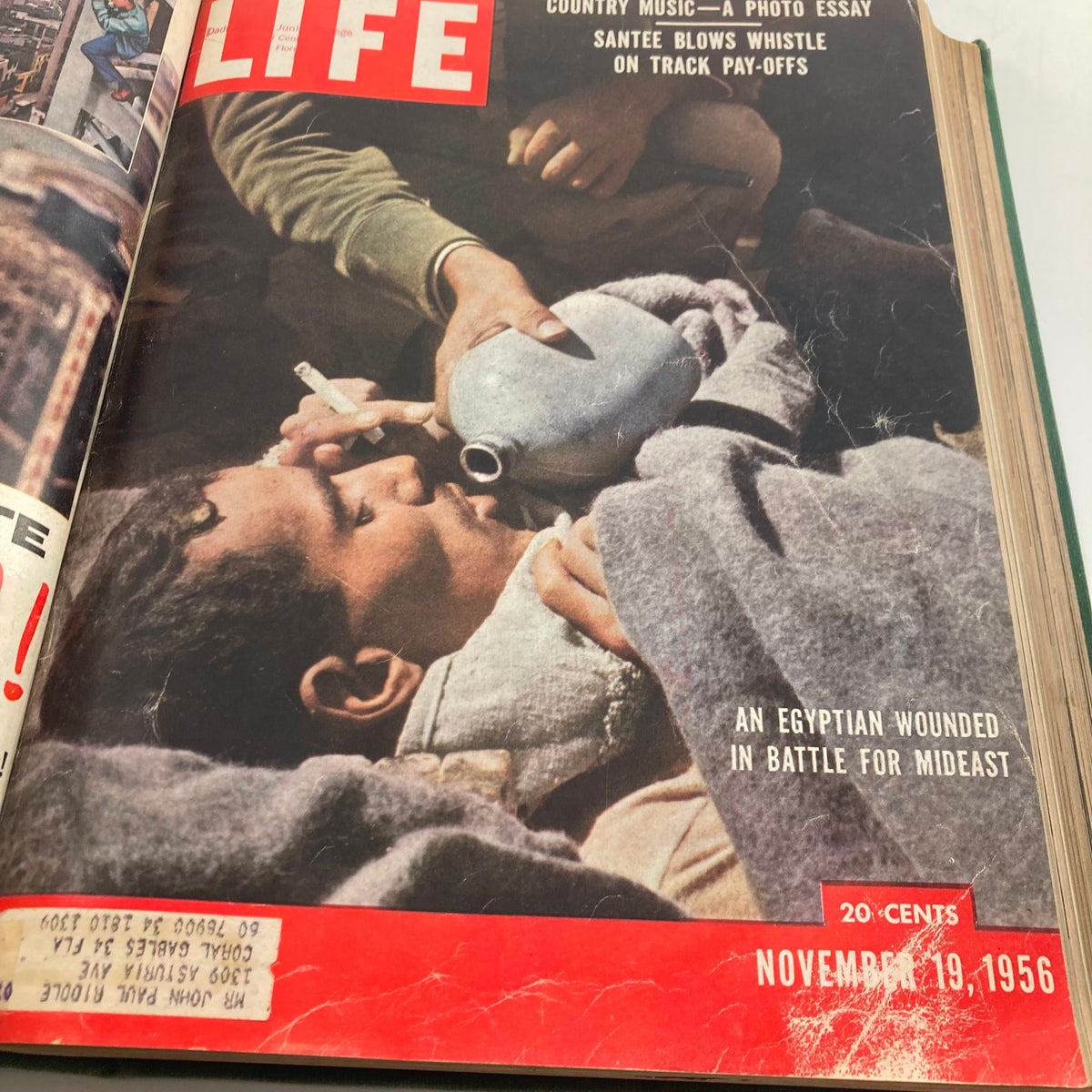 Vintage 1956 Bound LIFE Magazine featuring a cover image from November 19, 1956, depicting an Egyptian wounded in battle for the Mideast.