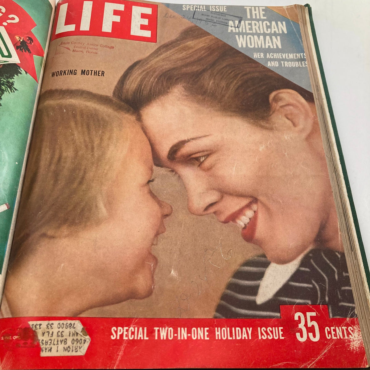 Cover of a November-December 1956 LIFE Magazine issue featuring a mother and child, highlighting themes of 'The American Woman' and 'Working Mother.' This vintage magazine cover is part of a bound collection, missing some covers, adding to its historical charm.