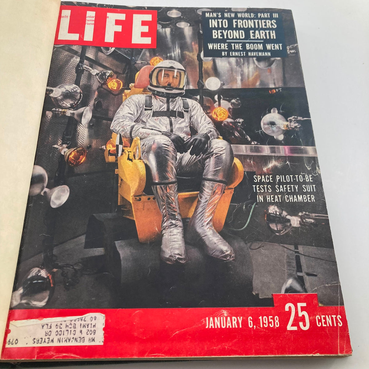 Cover of the January 6, 1958 issue of Vintage 1958 Bound Life Magazine, featuring an astronaut in a space suit testing equipment in a heat chamber.