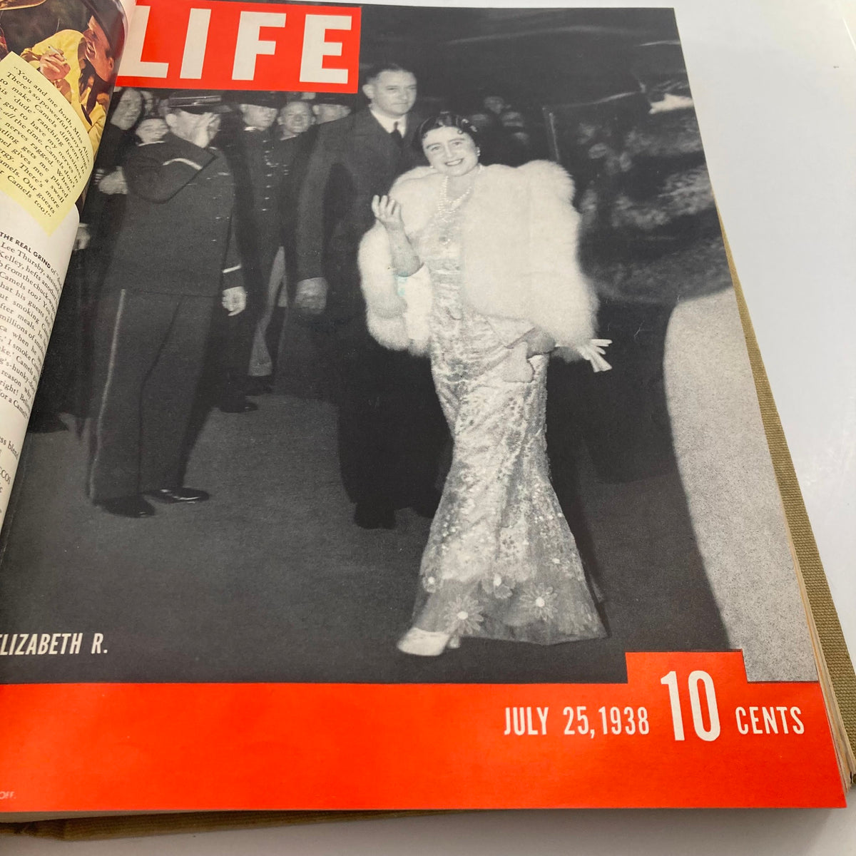 Cover of VTG 1938 Bound Life Magazine from July 25, featuring a glamorous woman in a silver dress and fur shawl, highlighting the elegance of the era.