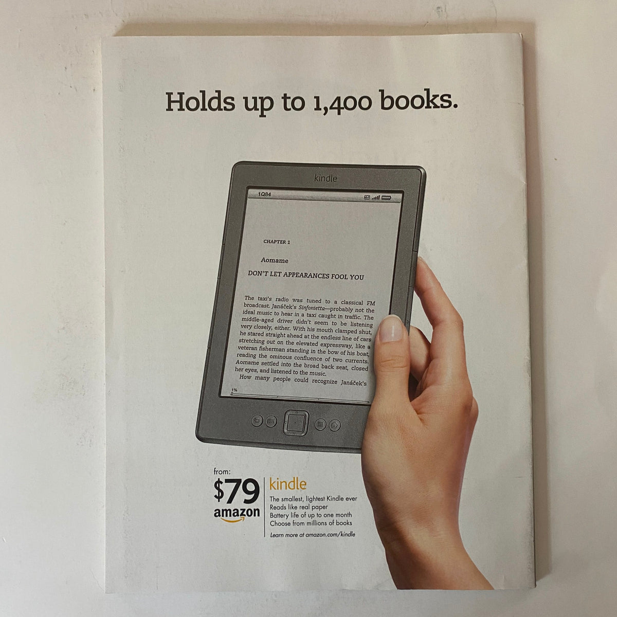 Advertisement for Kindle in Fortune Magazine February 6, 2012, showcasing the device's features and promoting the ability to hold up to 1,400 books.
