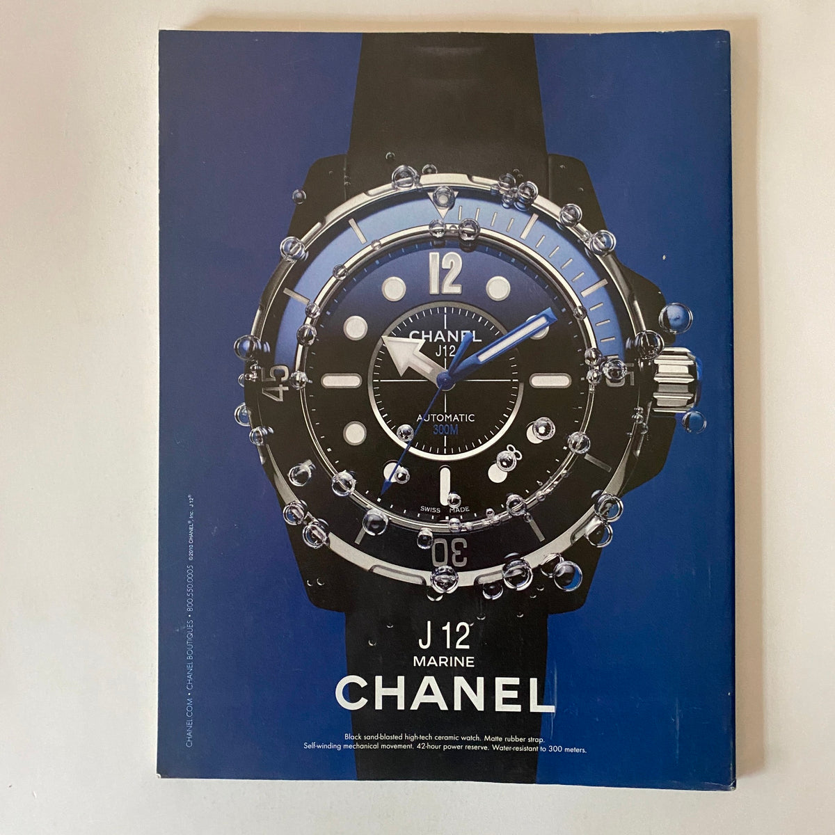 Back cover of Fortune Magazine October 18, 2010, featuring an advertisement for a Chanel watch with a striking blue background and water droplets.