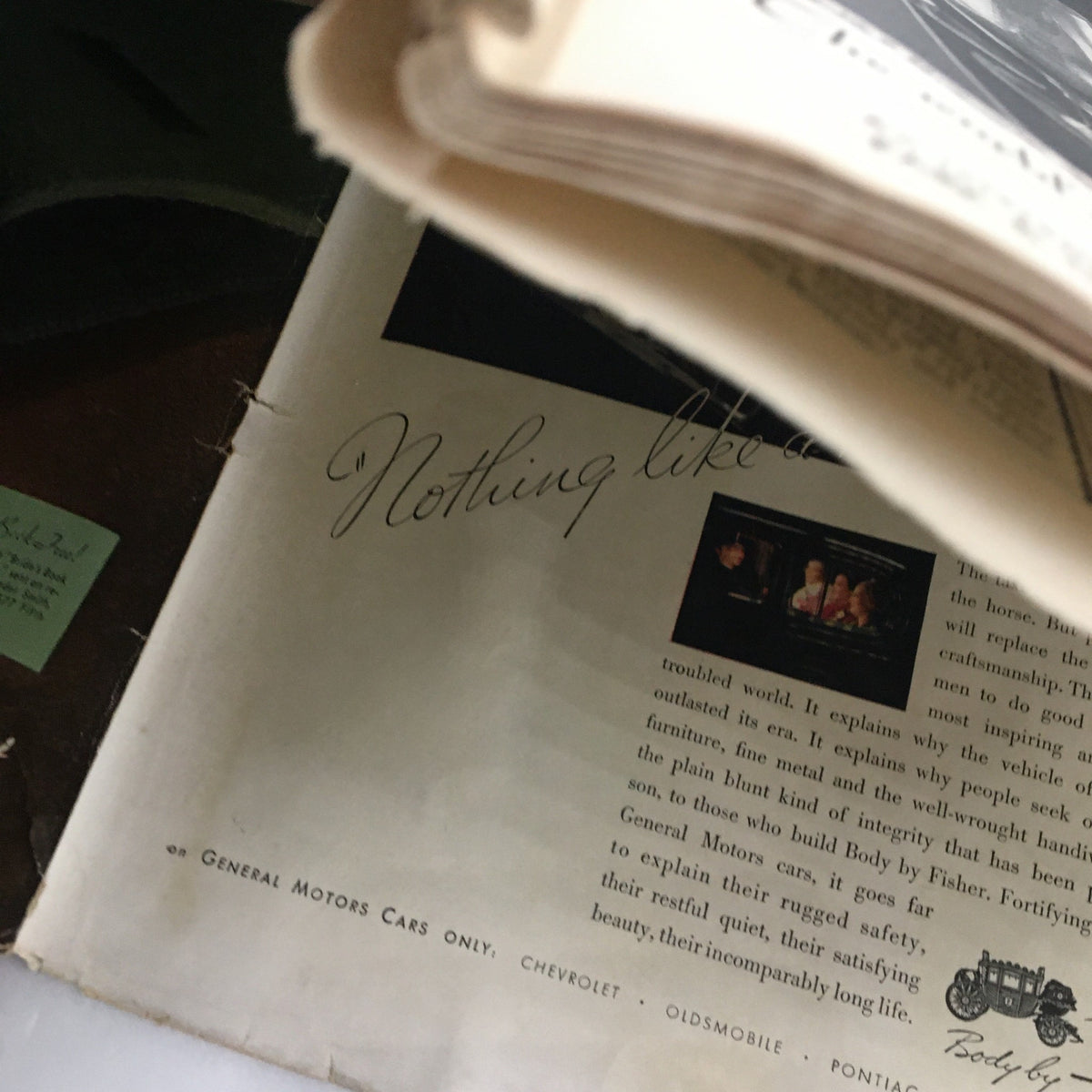 Close-up view of a vintage advertisement discussing General Motors cars from The New Yorker Magazine October 13 1934, highlighting luxury and craftsmanship.