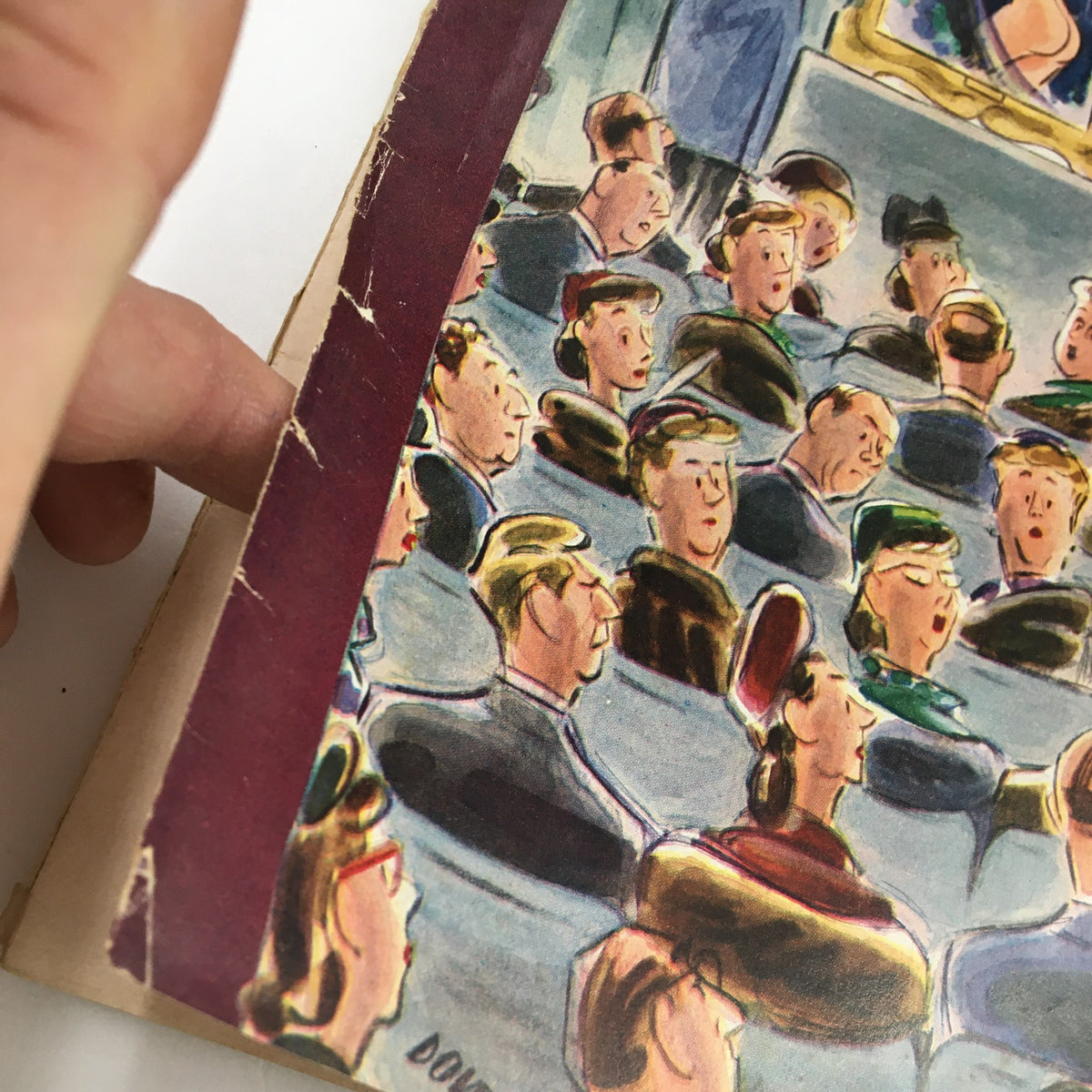 Close-up of the damaged spine and crowd illustration on the cover of The New Yorker Magazine January 6, 1951, highlighting its artistic details.