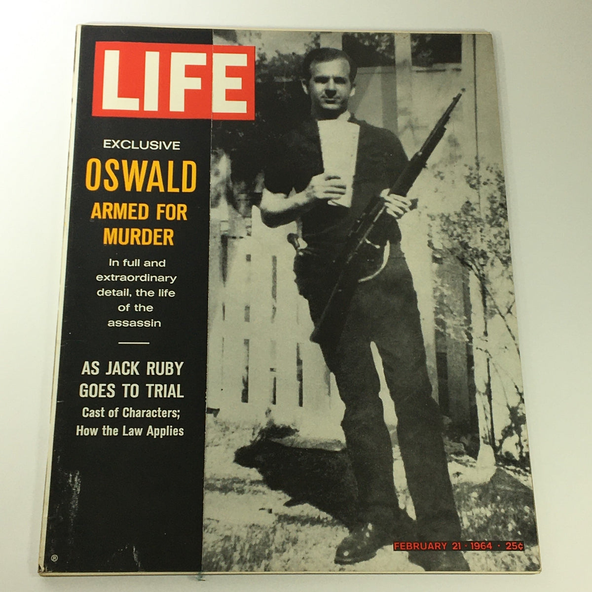 VTG Life Magazine February 21 1964 featuring Lee Harvey Oswald on the cover, highlighting the theme 'Oswald Armed for Murder'. The magazine depicts historical context from the 20th century.