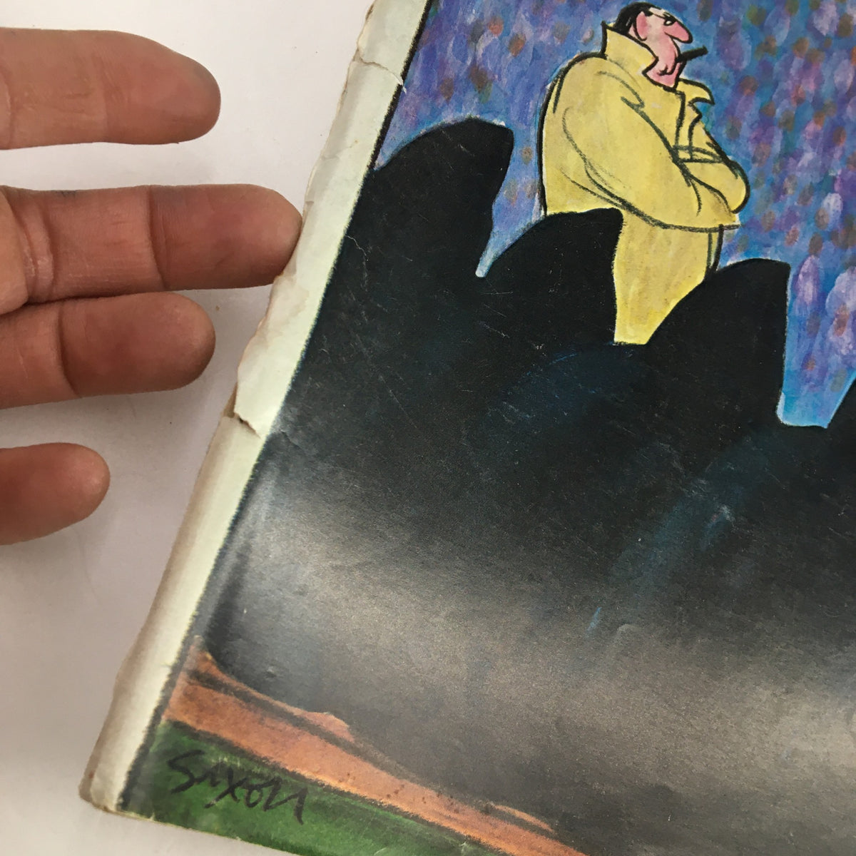 Close-up view of the cover detailing of The New Yorker Magazine November 11 1972, showing the illustration 'Man On a Hill' by Charles Saxon and the magazine's wear due to age.