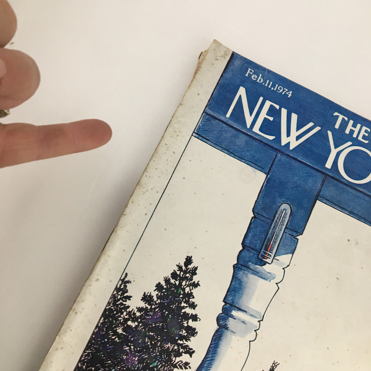 Close-up view of The New Yorker Magazine February 11 1974 cover, highlighting the intricate artwork by Arthur Getz with snowy scenery and a prominent thermometer.