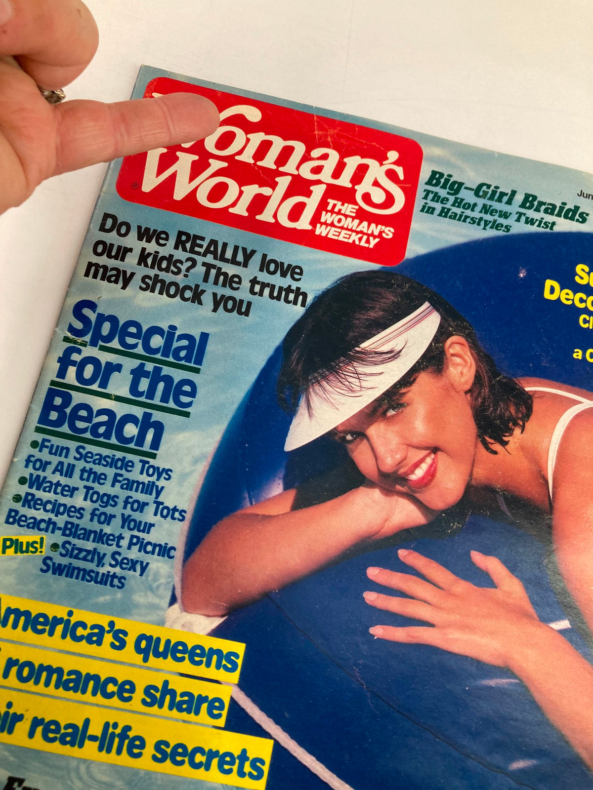 Close-up of the cover of Woman's World Magazine, June 25, 1985, highlighting the question about parenting and special beach features.