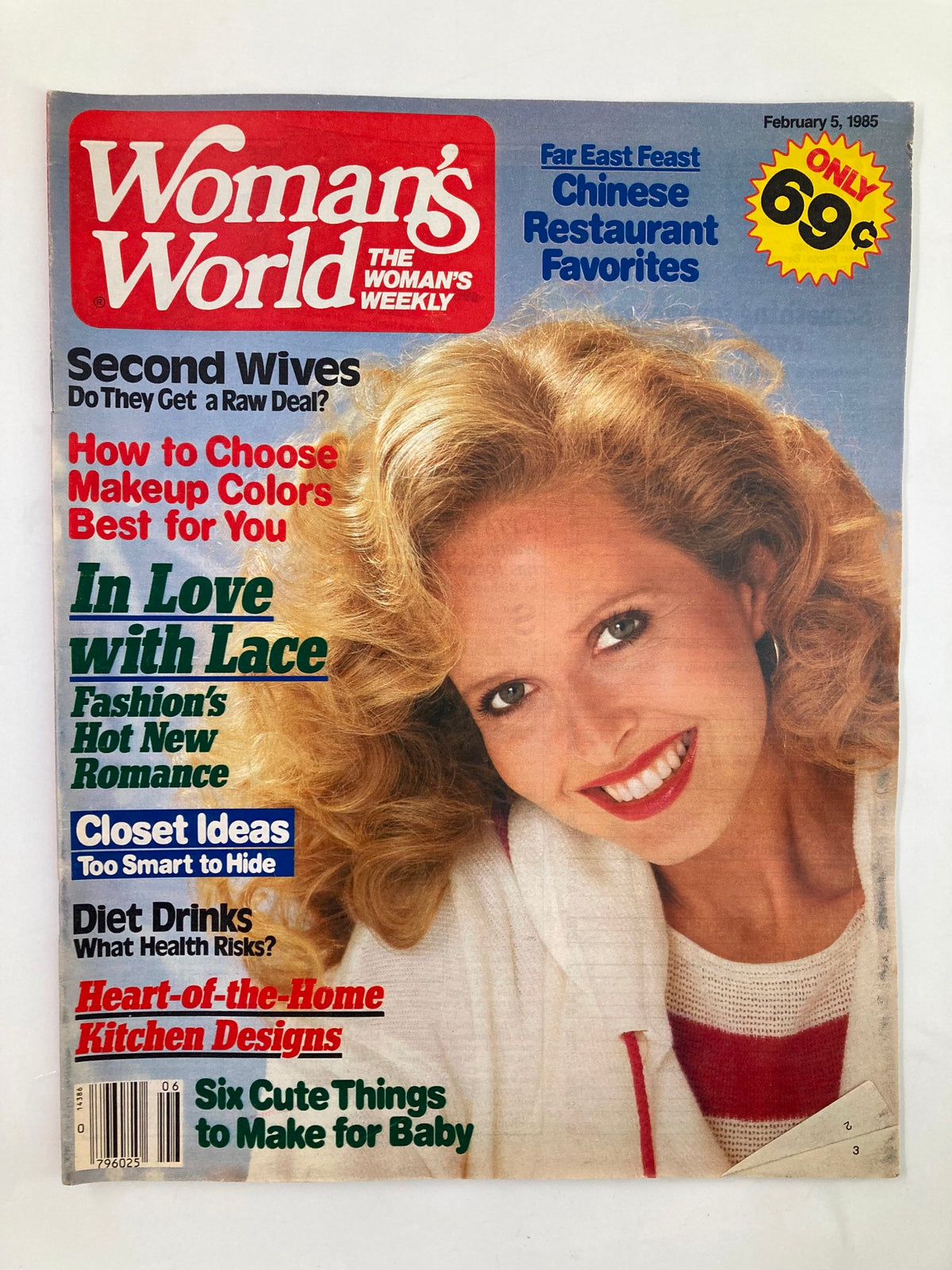 Cover of Woman's World Magazine, February 5, 1985, featuring articles on kitchen design, beauty tips, and romance themes, showcasing a smiling woman with curly hair.